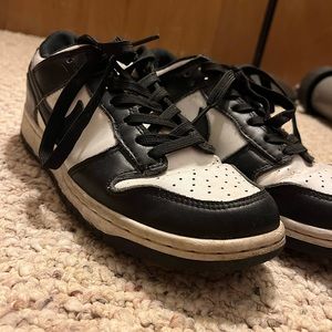 NIKE Women’s Dunk Low Basketball Sneaker in White/Black/White